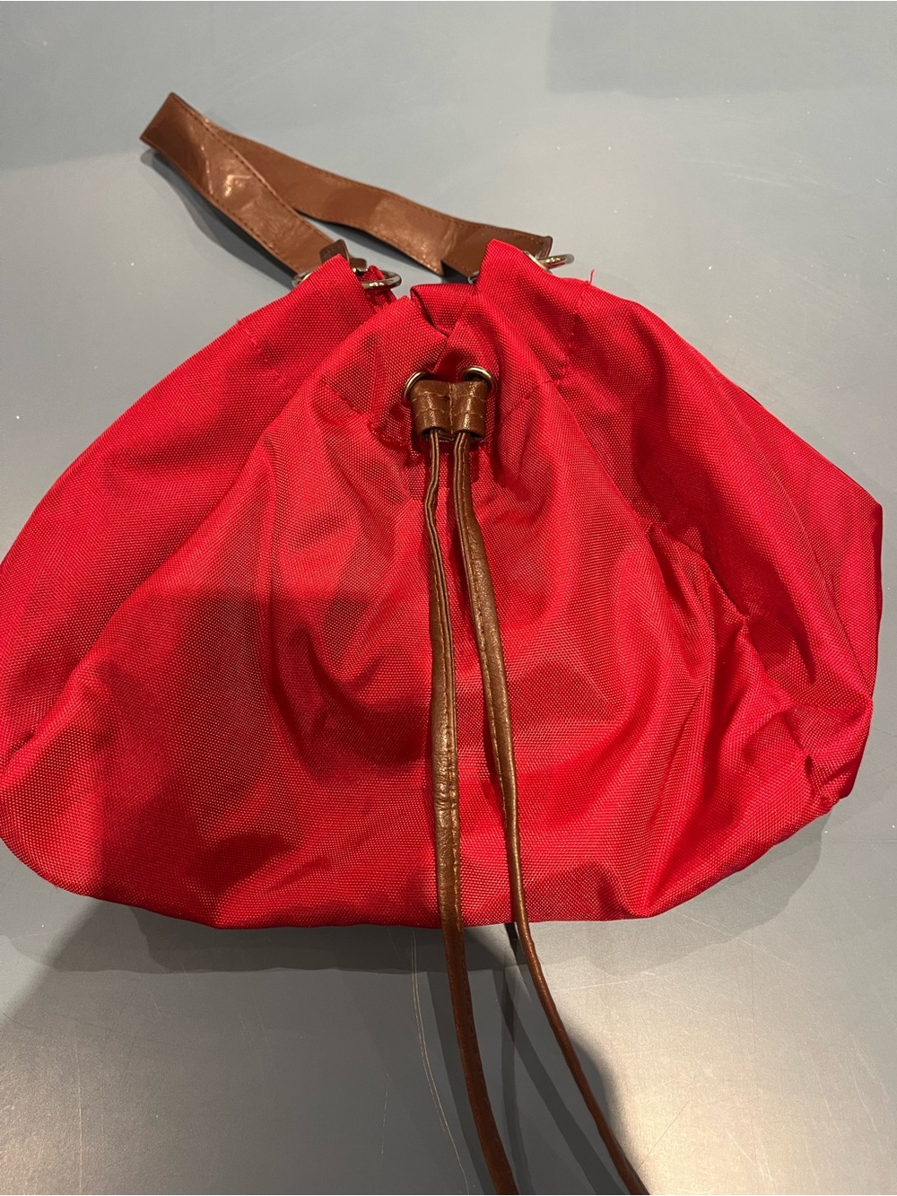 Red Drawstring Hobo Bag with Brown Trim
